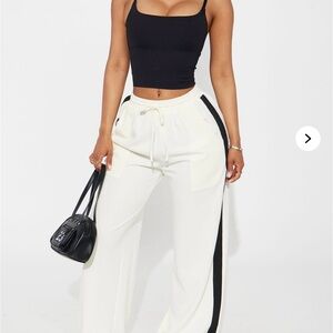 Women’s Fashion Nova stretch trousers white /black combo size small